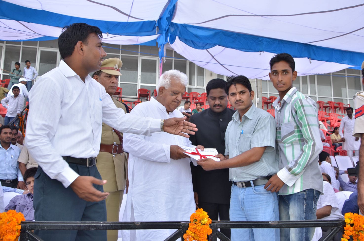 Award presentation on a public stage