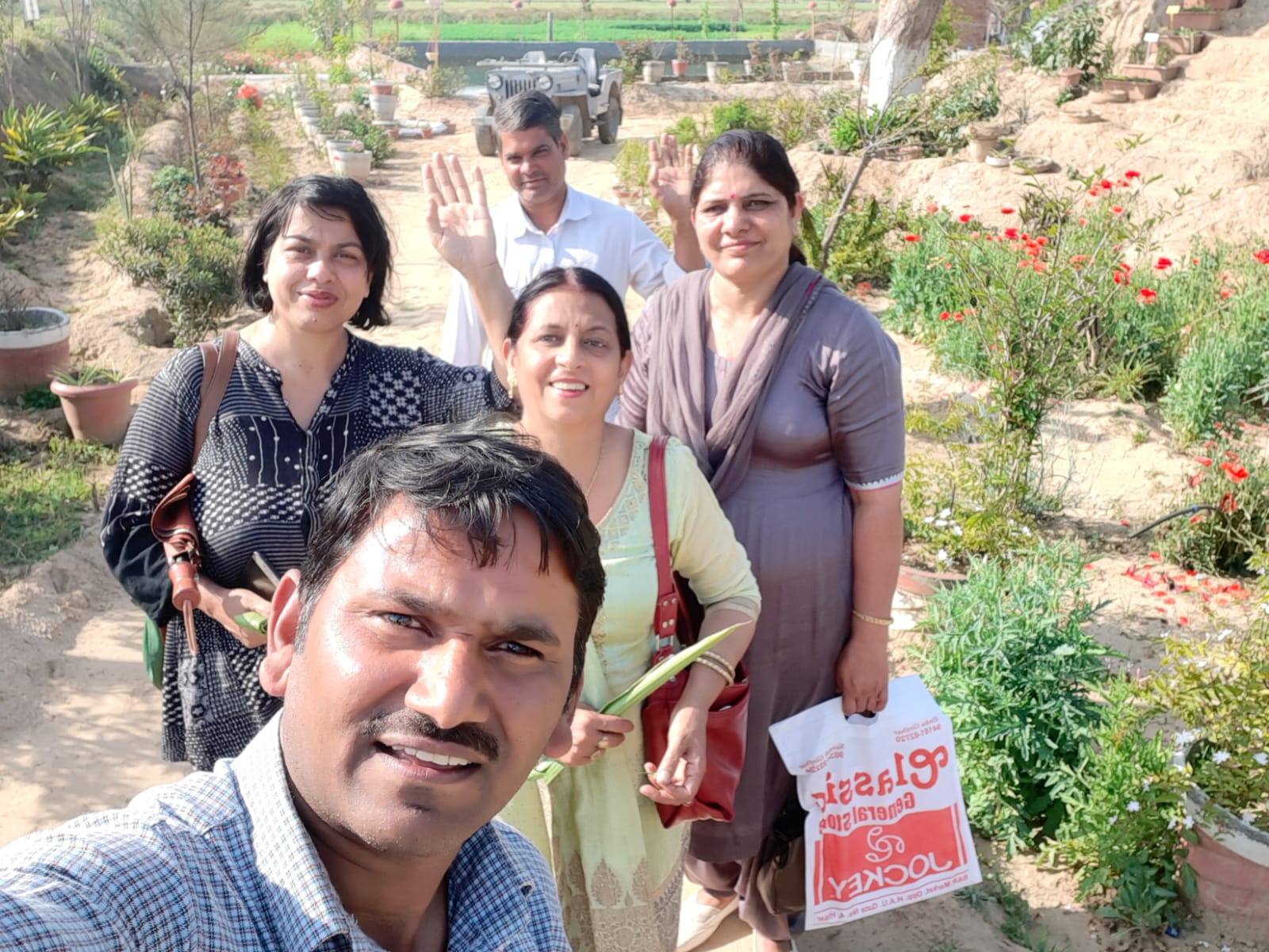 Visitors taking a group selfie during a farm visit